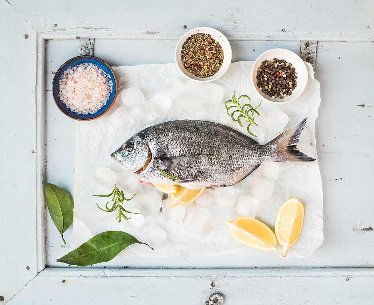Sea bream fish with lemon, herbs